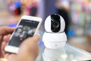 Male hand press phone watch CCTV a person checking the camera app on the phone