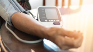 Elderly patient with bp, heart rate, digital pulse check equipment for medical geriatric awareness in stroke systolic high blood pressure, hypertension, hypotension and cardiovascular disease in aged senior older woman person a person getting the heart rate and blood pressure checked